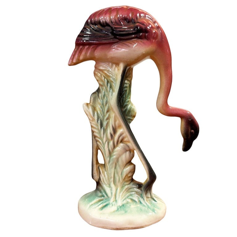 MCM California Pottery Ceramic Grazing Tropical Pink Flamingo Figurine Statue: Mid-century pink and green flamingo ceramic figurine grazing on a grassy field . The statue depicts a pink flamingo with long legs, a slim, tall form kneeling down to graze on a grassy field. It comes