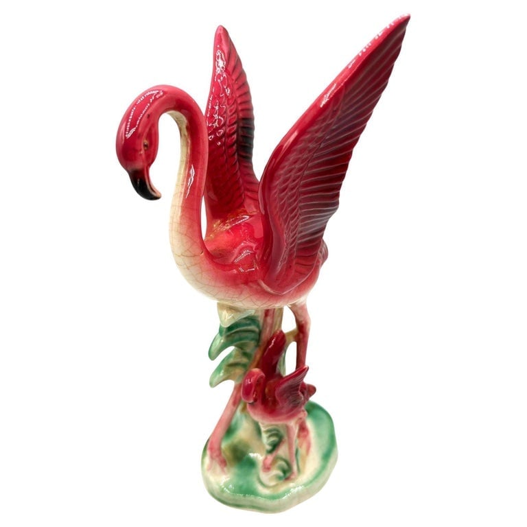 Mid-Century Child and Mother Flamingo Ceramic Statue By Leftons (REPAIRED): Mid-Century pink and green ceramic Mother and child tabletop pottery statue by Leftons. The statue features a beautifully detailed pink mother and daughter flamingo resting on a grassy field. It comes