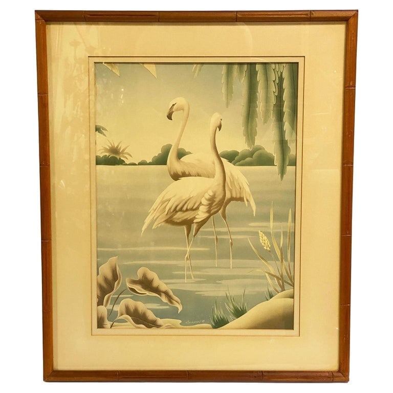 1940 Tropical Flamingo Lovers Scenic Print, by Billy Seay for Turner: Elegant coastal print by Billy Seay for Turner featuring two graceful flamingos wading in a tranquil lagoon surrounded by lush tropical foliage. Soft pastel tones and the bamboo-style frame create a