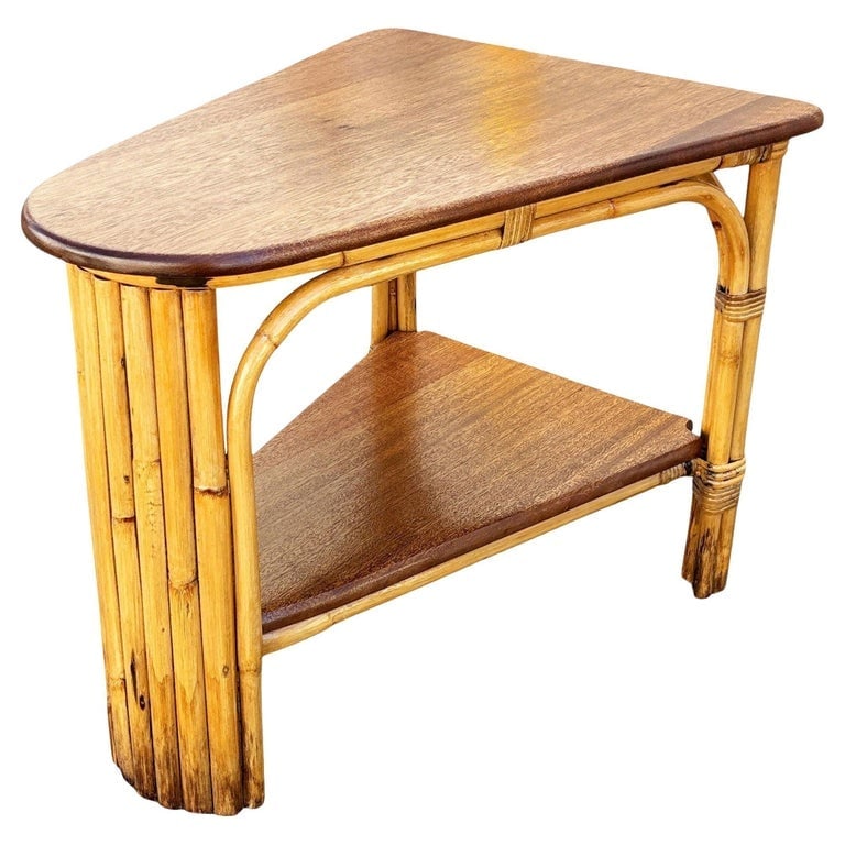 Restored MCM Rattan and Mahogany 7-strand Vertically Stacked Rattan Wedge Table: This beautifully restored rattan 7-strand wedge table blends style and vintage charm with modern comfort. Made in 1950, it features a set of 2 mahogany tops standing on a single-strand rattan frame