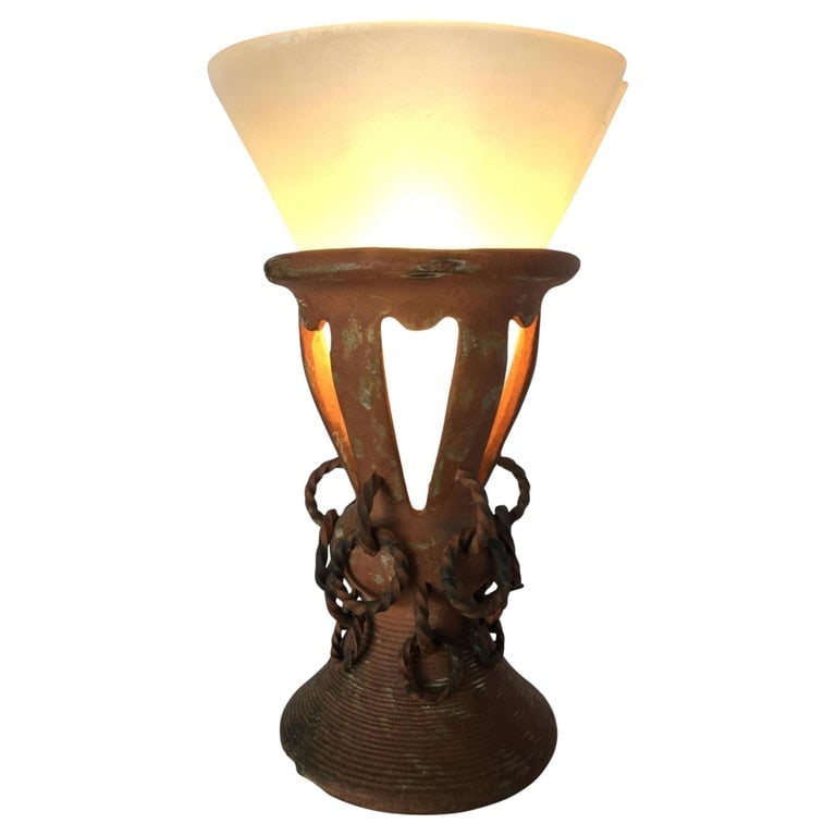 Iron and Clay Torchiere Table Lamp W/ Frosted Shade: Electric iron and clay torchiere table lamp with frosted shade. Available-2 Reserve: $89.00 Shipping: Domestic: Shipping rates are determined by destination International: Foreign shipping rates are