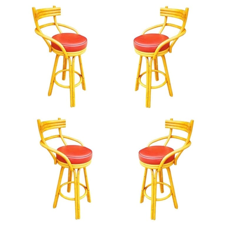 Restored Mid-century Rattan Stacked Bar Swivel Stools w/ Red Seat , Set of 4: Restored set of 4 mid-century era rattan barstools with stacked rattan backs with red Naugahyde swivel seats. Each stool blends style and vintage charm with modern comfort. Elevate your seating experi
