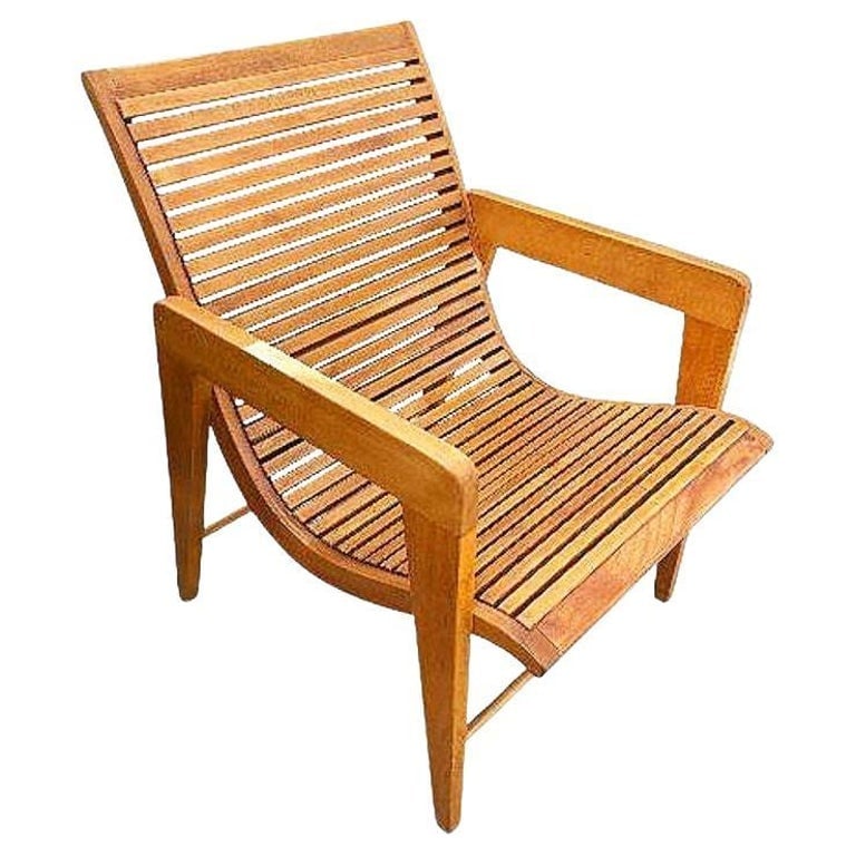 Bespooke Scandinavian Modern Blonde Slat Wood "Staple" Arm Lounge chair: Beautifully crafted mid-century style Scandinavian lounge chair featuring gently curved plywood staple arms and solid wood framing with slat wood seat. The design showcases clean architectural lines a