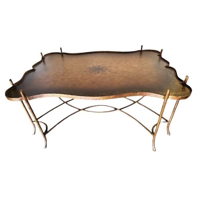 Maitland Smith Gilded Iron Faux Bois Tray Top Statement Tole Cocktail Table: Large 36" x 48" Hollywood Regency Tole cocktail/coffee table by Maitland Smith. The coffee table features a hefty Faux Boise iron base with beautiful faux carved wood details on the iron. The iron has