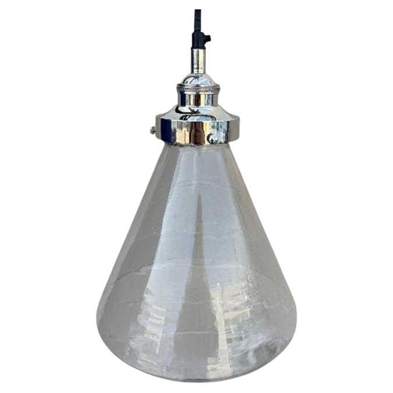 Industrial Aluminum Brushed Clear Glass Ceiling Pendant Light: Modern industrial lamp aluminum ceiling pendant with clear glass cone shade. Featuring a blown clear glass shade with a subtle textured finish with a sleek conical design, is complemented by a