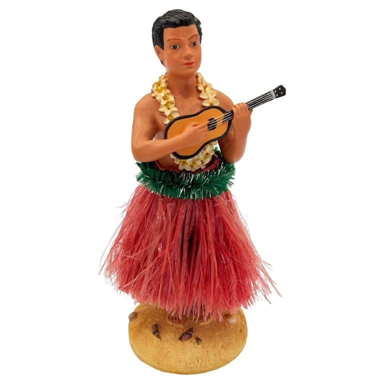 Ceramic Hawaii Hula Man Ukulele Player Bobble Doll: Original ceramic bobble doll Hawaiian hula boy playing a Ukulele made from lightweight plaster and painted in vibrant tropical colors. It depicts a young Native Hawaiian boy with a Ukulele in hand. Si