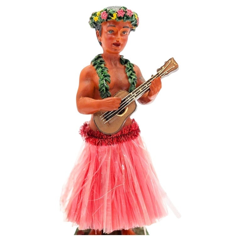 Ceramic Hawaii Hula Man Ukulele Player with headdress Bobble Doll: Original ceramic bobble doll Hawaiian hula boy playing a Ukulele made from lightweight plaster and painted in vibrant tropical colors. It depicts a young Native Hawaiian boy with a Ukulele in hand