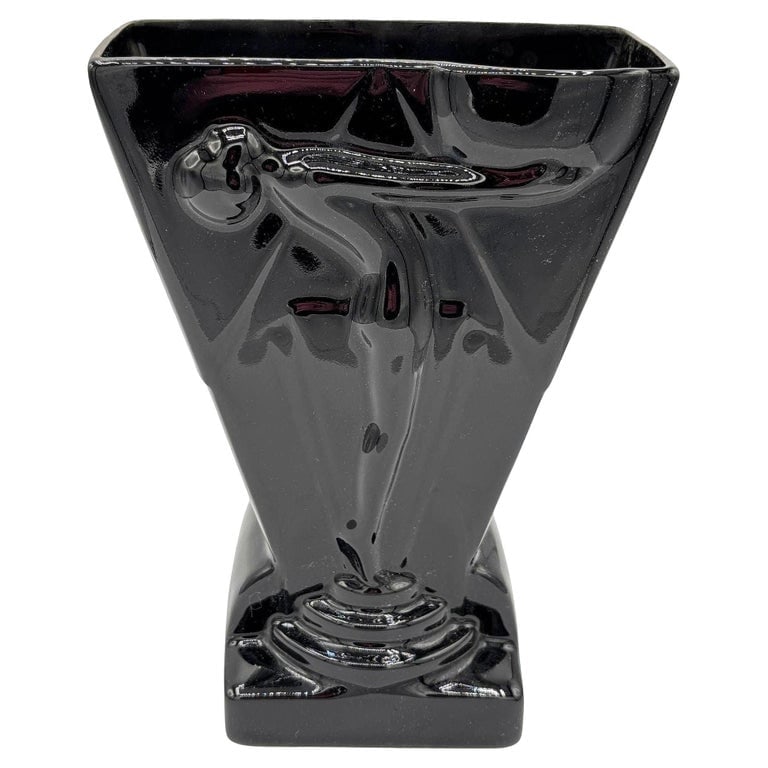 1985 Art Deco Black Pottery Vase Figure Figurine Sculpture Vase by Pelzman Design: 1985 Art Deco style black pottery vase Figure figurine sculpture vase by Pelzman Design. The vase features a high gloss finish and features a relief of a Figure woman standing on a pedestal, arms stre