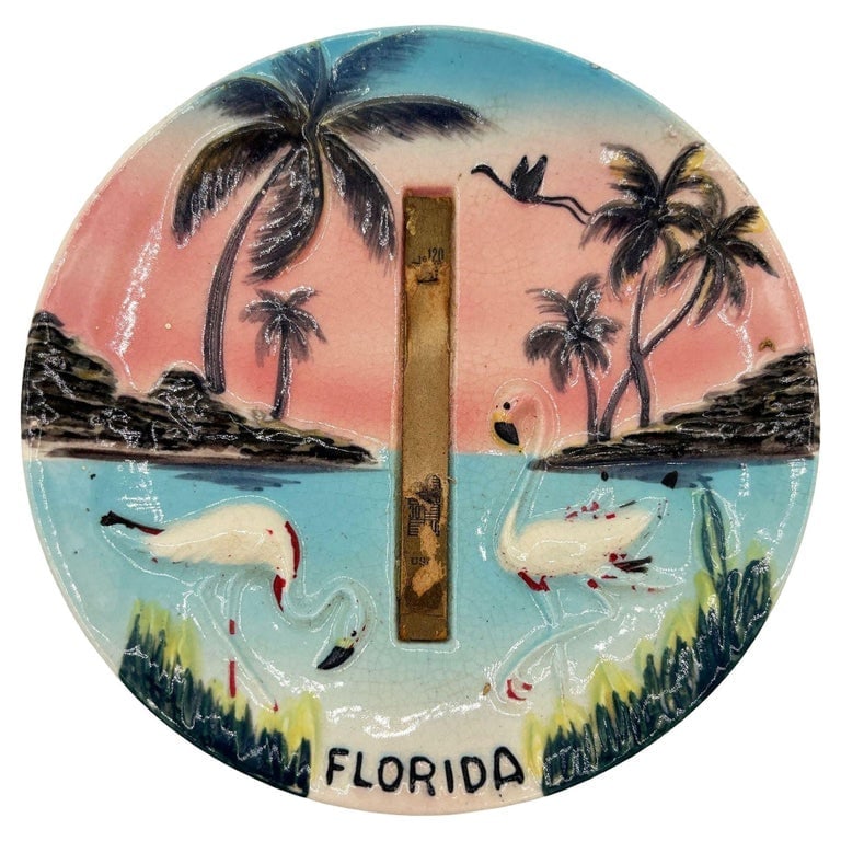 Mid-century Florida Flamingo Round Decrotive 3d Sculptural Wall Plate: Mid-century pink and green 3d sculptural ceramic California pottery flamingo theme beach Plate. The wall plate features a beautifully detailed pair of pink flamingos on a sunset beach. It comes in a g