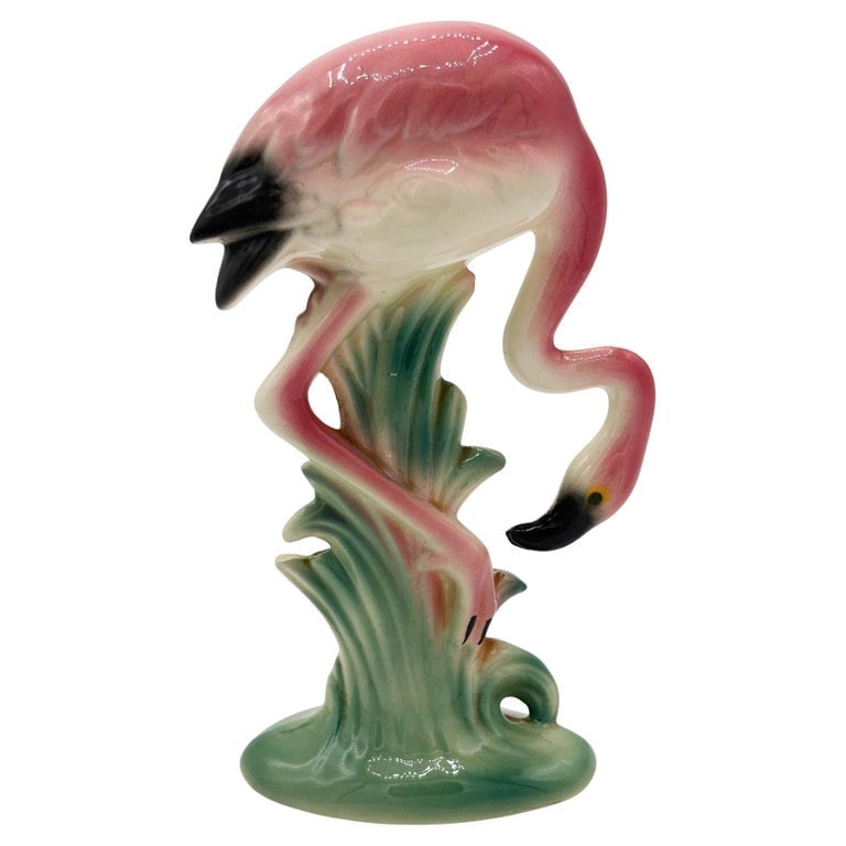 MCM California Pottery Ceramic Searcher Tropical Pink Flamingo Figurine Statue: Mid-century pink and green long-legged "Searcher" flamingo ceramic figurine. The statue detailed a pink flamingo with long legs, a slim, tall form searching the grassy field. It comes in a gloss finis