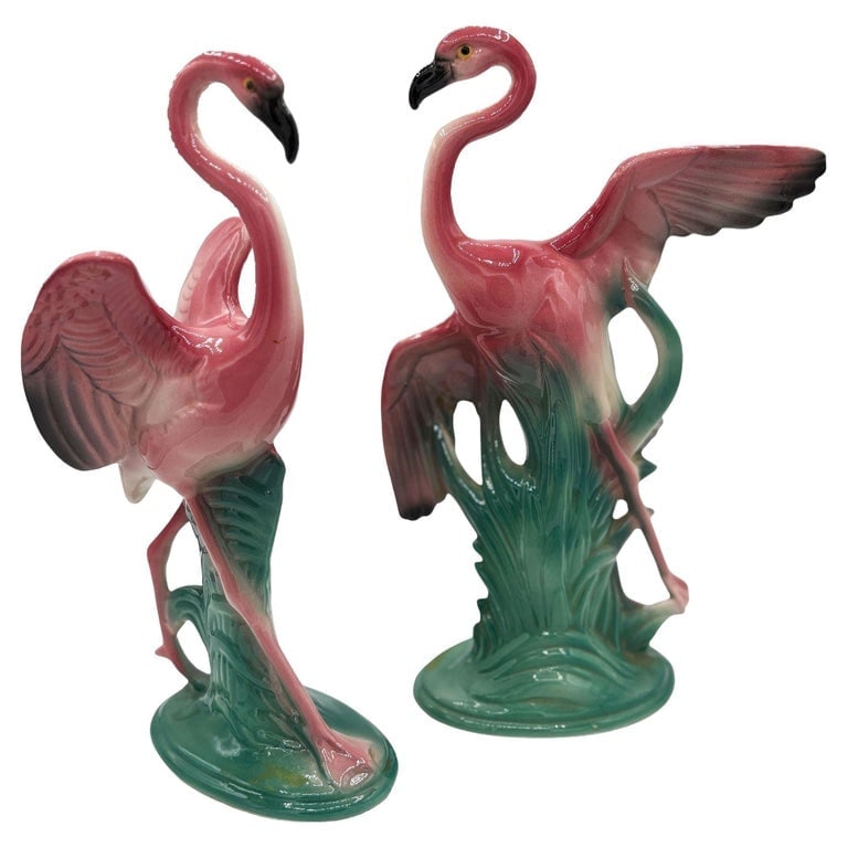 Mid-century 11" Tall Open Wing Pink Flamingo Ceramic Tabletop Statue, Pair: Set of two Mid-century pink and green ceramic open-wing flamingo tabletop pottery statues. Each statue features a beautifully detailed pink flamingo flying over a grassy field. The Large statue featur