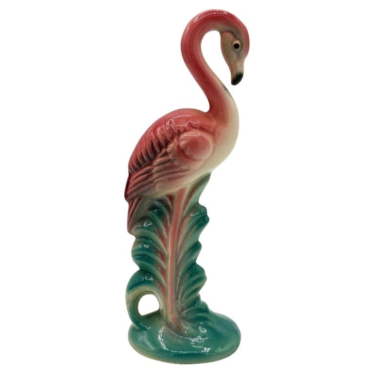 Mid-century California Pottery Ceramic "Gazer" Pink Flamingo Figurine Statue: Mid-century pink and green long-legged "Gazer" flamingo ceramic figurine. The statue detailed a pink flamingo with long legs, a slim, tall form standing on a grassy field looking beyond the horizon. I