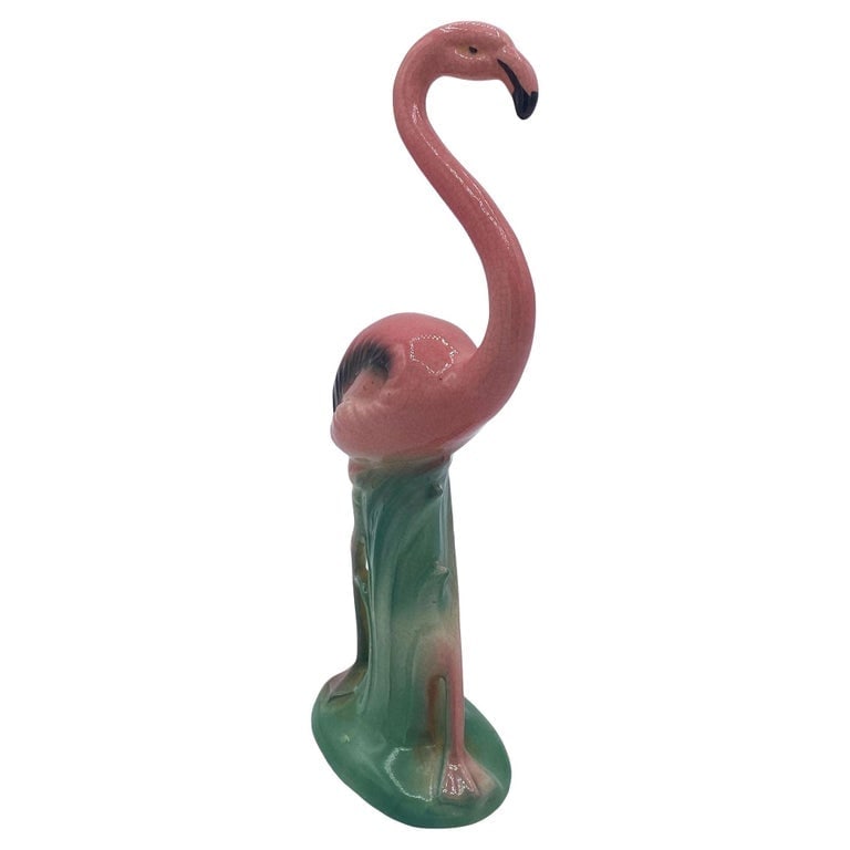 Mid-century "Handsome" Pink Flamingo Ceramic Tabletop Statue By Leftons: Mid-century pink and green ceramic handsome flamingo tabletop pottery statue by Leftons. The statue features a beautifully detailed pink flamingo standing on a grassy field. It comes in a gloss finish