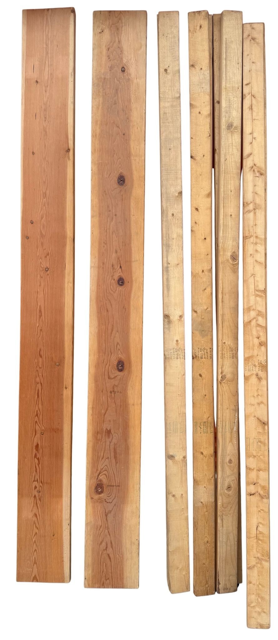Assorted Lumber Including Studs and Plank Boards: A collection of assorted lumber, featuring several 2x4 studs and wider planking, some branded with 'KD-HT Stud' indicating Kiln-Dried Heat Treated lumber, and 'FIR' suggesting Fir wood. The lumber is