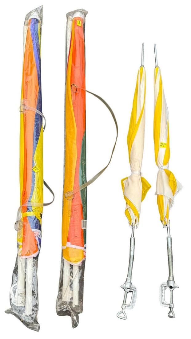 Collection of Two Vintage Beach Umbrellas large and two small with Clamps: A collection of four vintage beach umbrellas, perfect for a sunny day out. Two of the umbrellas feature a vibrant yellow and white striped pattern, equipped with metal clamps for easy attachment to