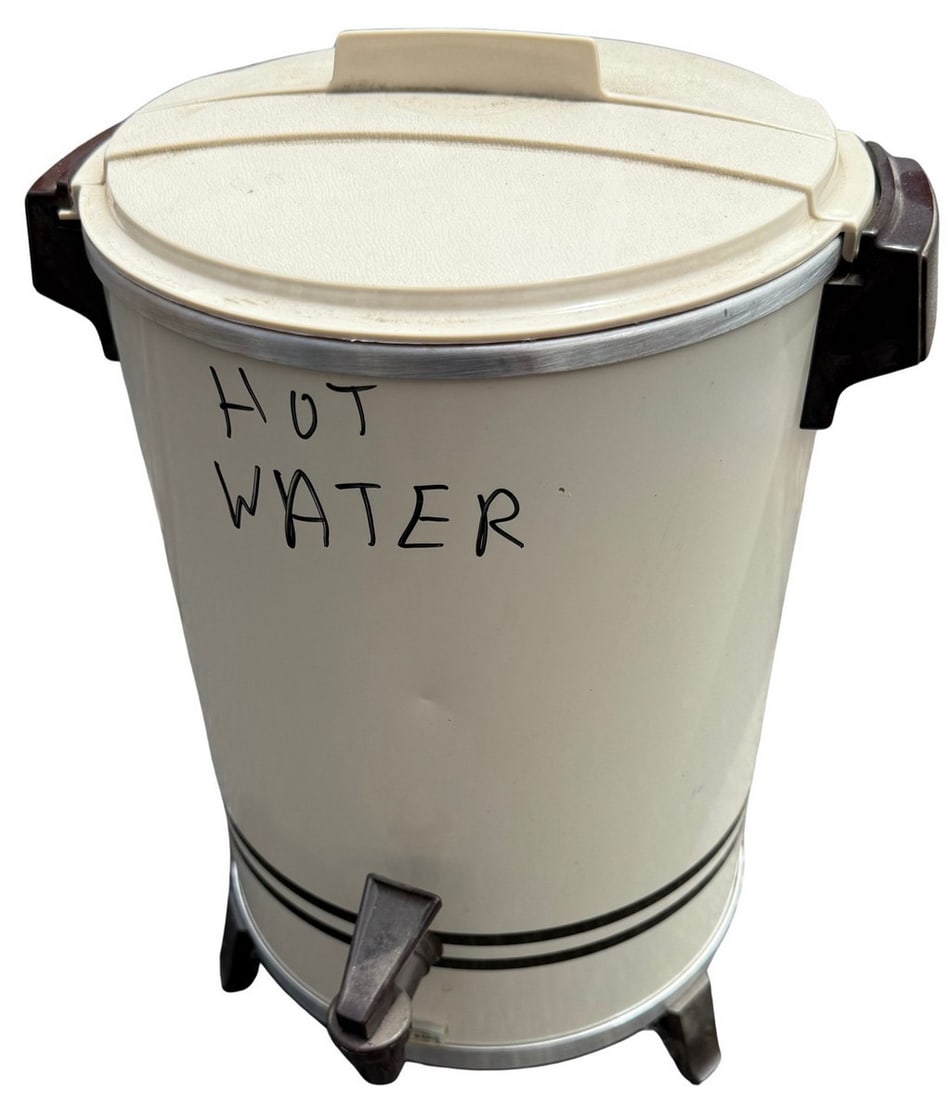 Vintage "Hot Water" Dispenser, Mid-20th Century: A vintage electric hot water dispenser, likely from the mid-20th century, featuring a cream-colored painted metal body with two black decorative stripes and brown Bakelite handles and spigot. The