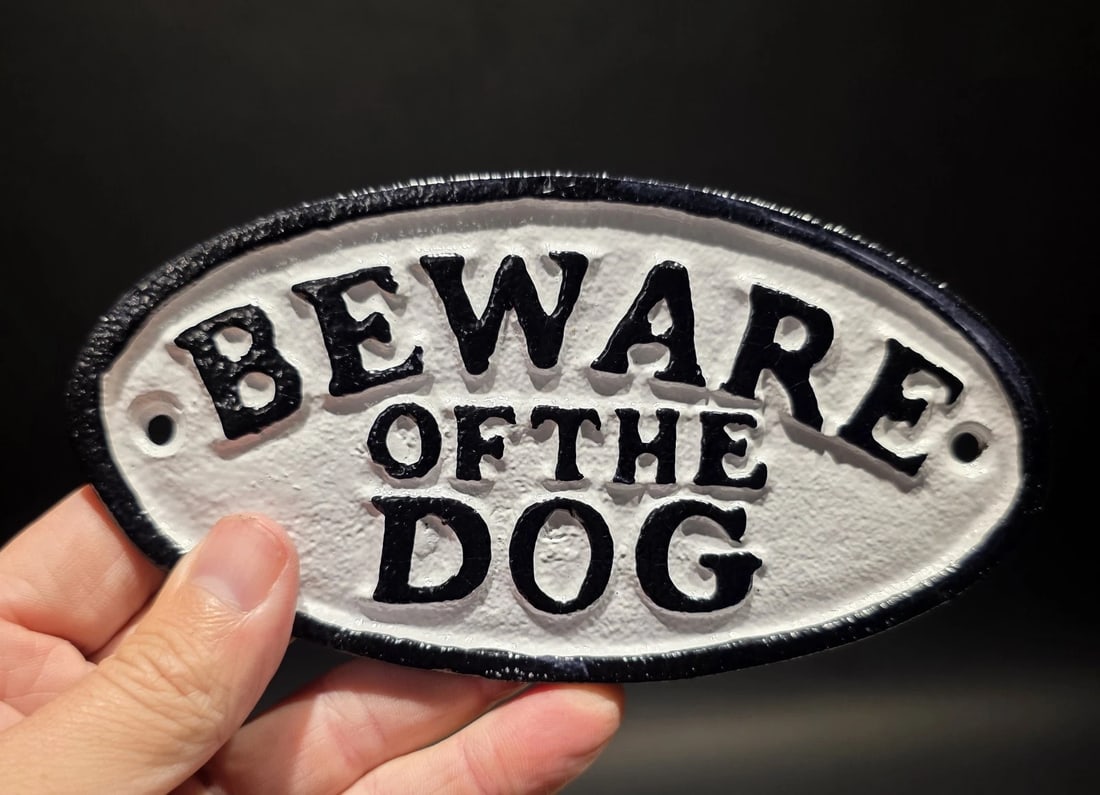 6 1/2" Cast Iron Beware of the Dog Sign Plaque: 6 1/2" Wide This reproduction cast iron sign is a classic piece of functional hardware with a traditional, rustic aesthetic. It is commonly used as a gate or fence plaque to inform visitors of a dog o