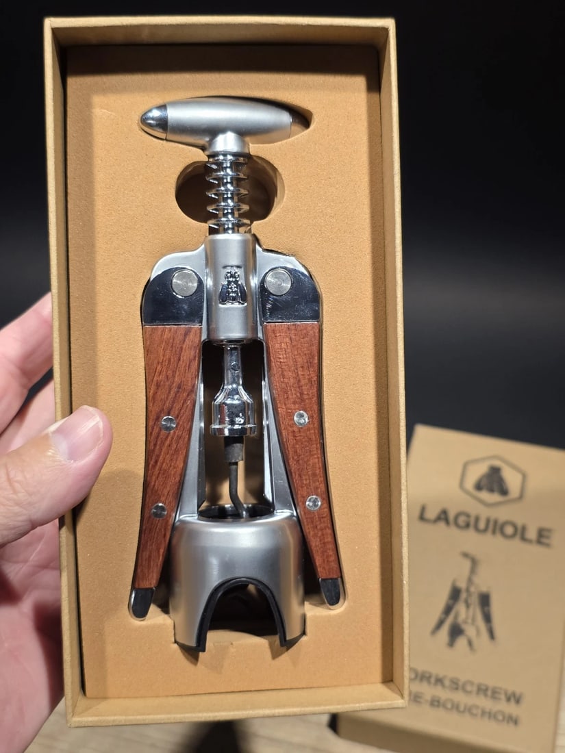 Laguiole Corkscrew with wood Handles Vintage Style: 7 1/2" Tall 3" Wide Nice quality heavy wing style Laguiole corkscrew! The heavy weight corkscrew (15.2 oz.) has wood inlaid handles. Open spiral with non-stick black surface on spiral. Reserve: $40.00