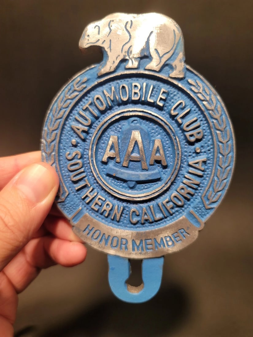 Aluminum AAA Car License Plate Fob Topper: 5" tall x 3 1/4" Wide Wonderful reproduction AAA license plate topper. Good detail cast aluminum hand painted and slightly aged to look like an antique. Certainly hard to tell its age. Reserve: $20.00
