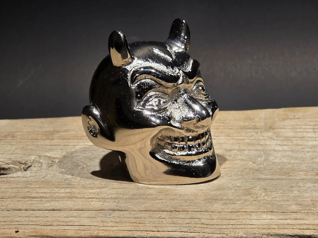 Devil Skull Metal Shifter Knob Hood Ornament- Undrilled: Chrome plated aluminum devil skull head rooted in classic hot rod and custom car culture. Likely intended as a shifter knob or ornament with an undrilled base allowing the owner to fit or display as