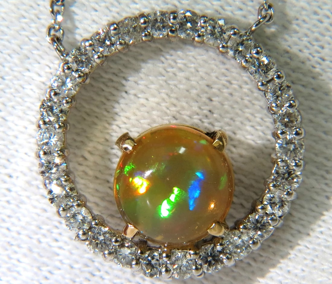 2.60CT NATURAL VIBRANT OPAL DIAMOND NECKLACE 14KT**: Title: 2.60CT NATURAL VIBRANT OPAL DIAMOND NECKLACE 14KT** Description: ONLY MAGNIFICENT JEWELS . 1.60ct. Natural Opal Cabochon cut Superb Vibrant Flashes of colors Reds, Orange, Blues and Greens.