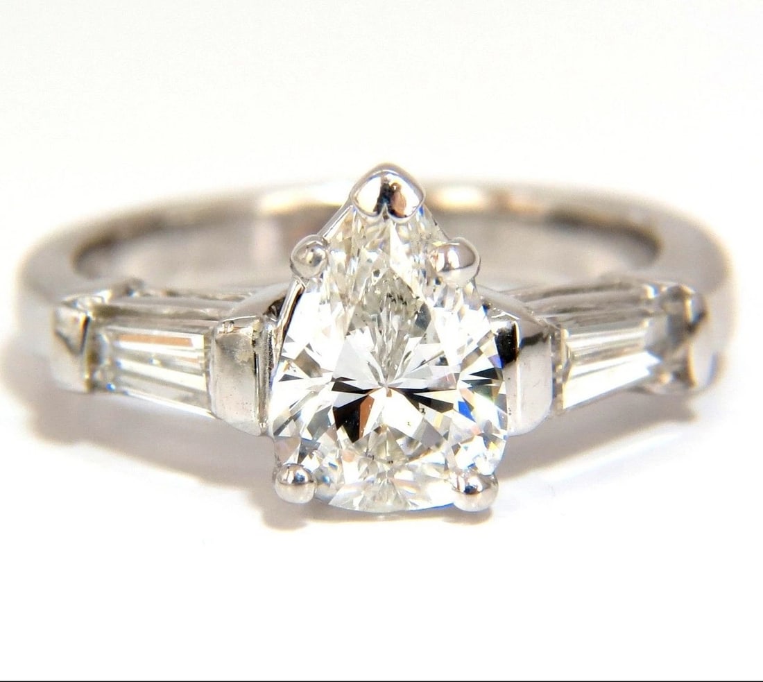 GIA 1.74CT NATURAL PEAR BRILLIANT DIAMOND RING CLASSIC THREE ENGAGEMENT 14KT *v: Title: GIA 1.74CT NATURAL PEAR BRILLIANT DIAMOND RING CLASSIC THREE ENGAGEMENT 14KT *v Description: GIA certified, Classic Three 1.44ct. Center Pear Brilliant diamond. GIA Report: 1122010875 F-color