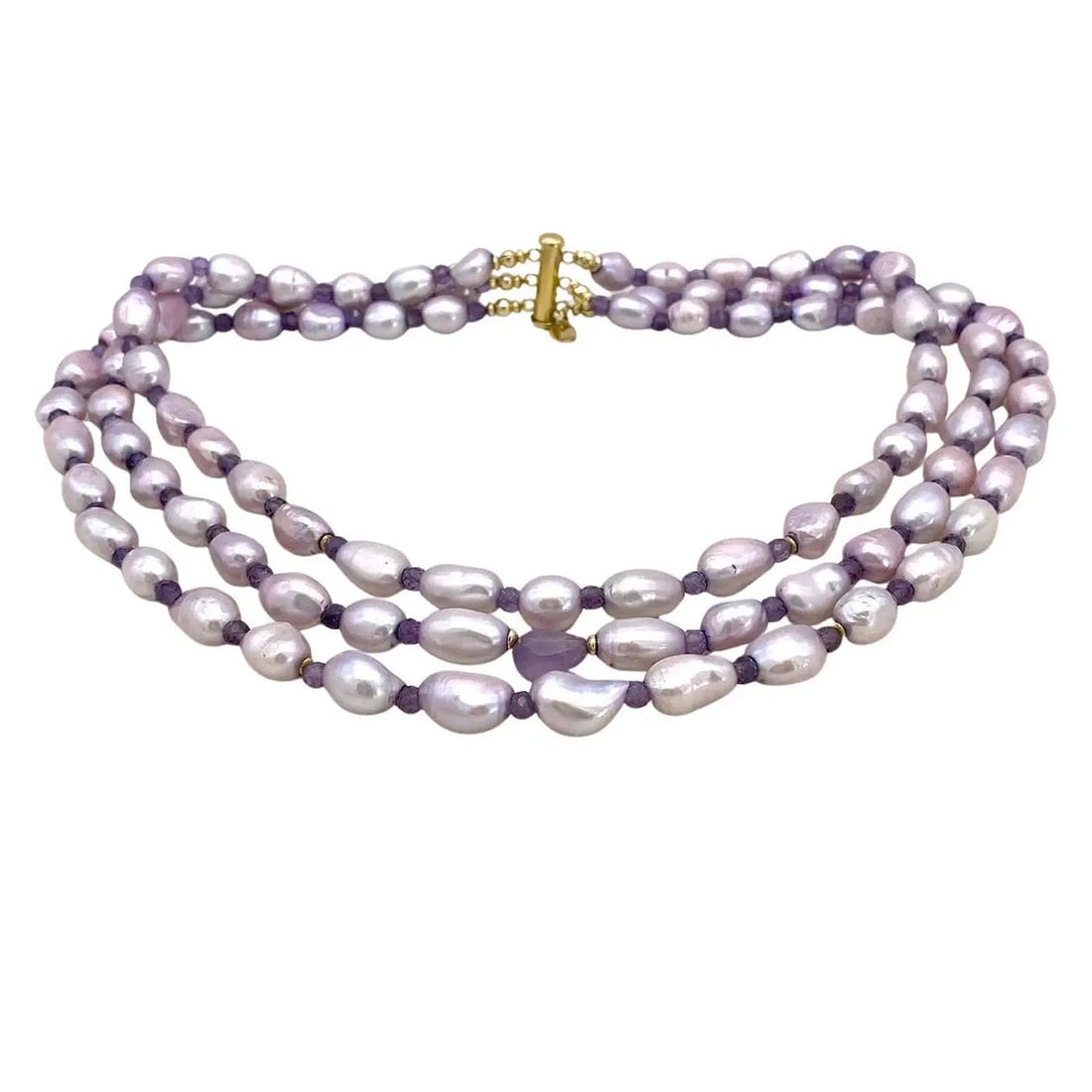 Freshwater Pearl Triple Strand Necklace: This is a triple strand natural baroque pearl and amethyst necklace. We created it with up to 15mm dyed lavender color pearls and 4 mm faceted round amethysts as spacers and accented it with a 12 mm a