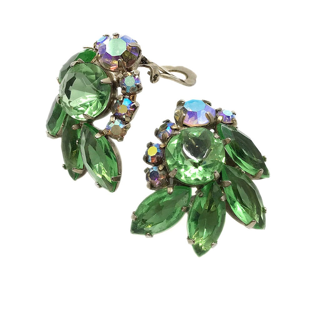 Dande Juliana Green And Clear Earrings: Here is a pair of identified 1960s DandE Juliana clip back earrings with green faceted and aurora borealis clear rhinestones prong set on gold-tone metal. Dimensions: 1.125 x 1.25 x 0.75 inch Reserve: