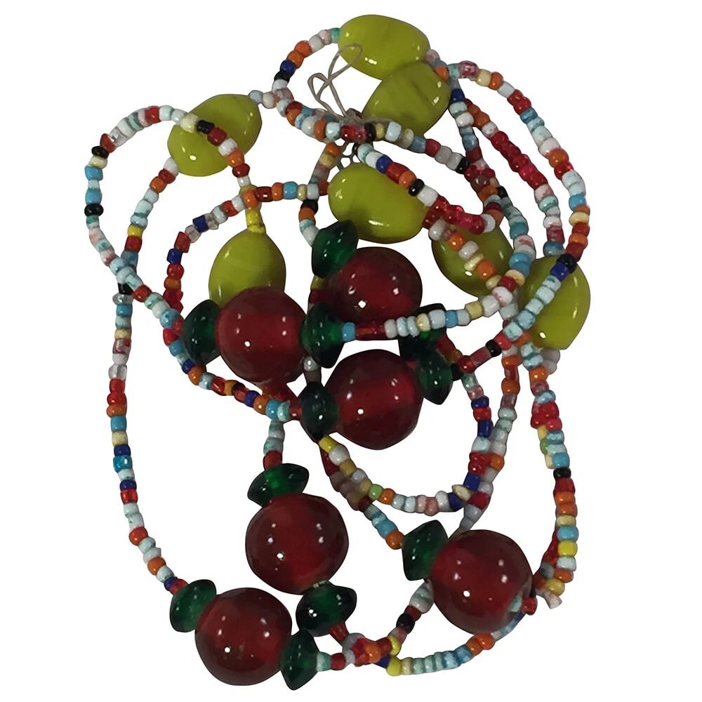 Hand Made Southeast Asian Blown Glass Bead Necklace: Title:Hand Made Southeast Asian Blown Glass Bead Necklace Description:Hand Made Indian Blown Glass Bead Necklace. Circa 1950s. Measures 38" long and 1/2" wide. Endless with no clasp, unmarked. Reserve