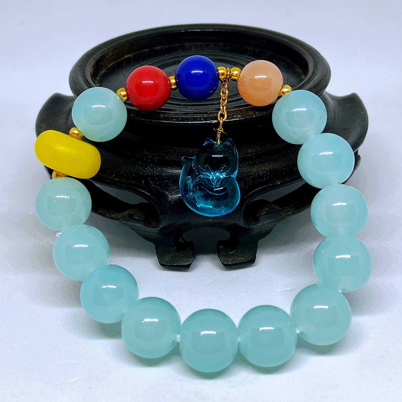 Peking Glass Beads Elastic Yoga Healing Bracelet With A Blue Crystal Fox Charm: Title: Peking glass beads elastic Yoga healing bracelet with a blue crystal fox charm Description:Peking glass originated in 18th century China during the rule of the Qing Dynasty. While China had
