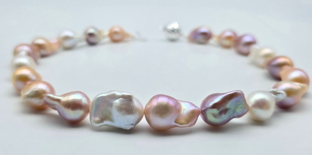 Necklace Featuring Imposingly Sized Nucleated Baroque (Edison) Pearls. This Piece Celebrates The: Title:Necklace featuring imposingly sized nucleated baroque (Edison) pearls. This piece celebrates the aesthetic of perfect imperfection, where each pearl is a one-of-a-kind natural sculpture. Descrip