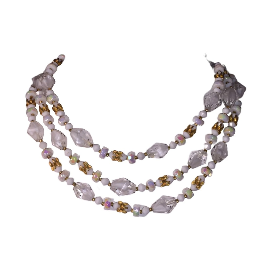 Hattie Carnegie Multi Strand Faceted Glass Necklace: Title:Hattie Carnegie Multi Strand Faceted Glass Necklace Description:Gorgeous triple strand of clear and white beads, accents of gold plated spacers. Circa 1950's Measures 15" to 18" with drop and an