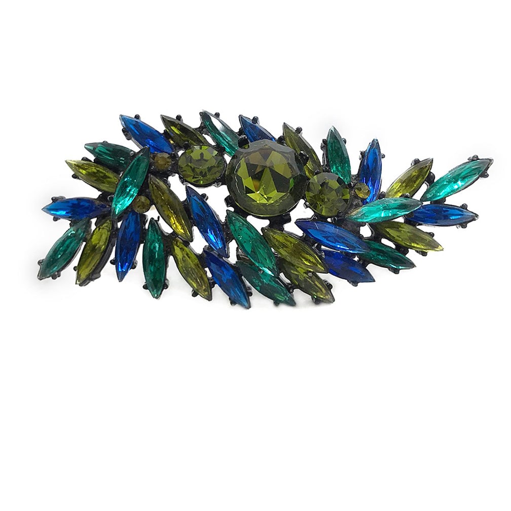 Regency Multi-Color Brooch-2: This is a 60s Regency multi-color leaf shaped brooch mixed with olive green, teal green and royal blue rhinestones all prong set on japanned black finish metal. Dimensions: 3.5 x 1.63 x 0.75 inch