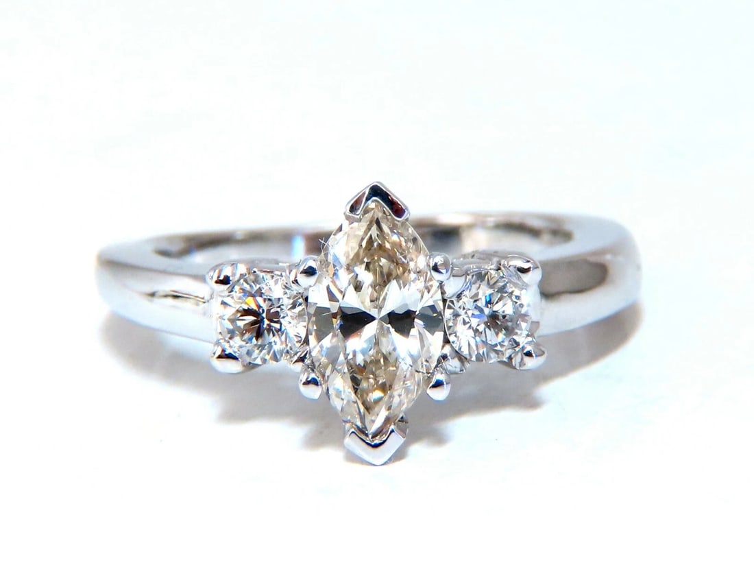 1.00ct Natural Marquise Diamond Ring 14 Karat Gold Classic Three *v: Title: 1.00ct Natural Marquise Diamond Ring 14 Karat Gold Classic Three *v Description: MAGNIFICENT JEWELS Marquise Classic Three. .72ct. Natural Marquise diamond Ring I-color, Si-1 clarity 7.8 x 4.7m