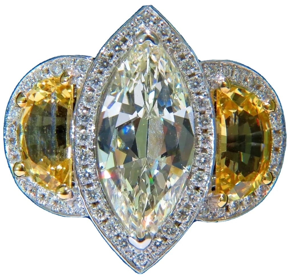 GIA CERTIFIED 18KT GOLD 7.82CT MARQUISE DIAMOND SAPPHIRE RING NO HEAT **v: Title: GIA CERTIFIED 18KT GOLD 7.82CT MARQUISE DIAMOND SAPPHIRE RING NO HEAT **v Description: MAGNIFICENT JEWELS Award winning design GIA: 3.50ct. Marquise diamond O-P color, Vs-1 clarity Side sapphir