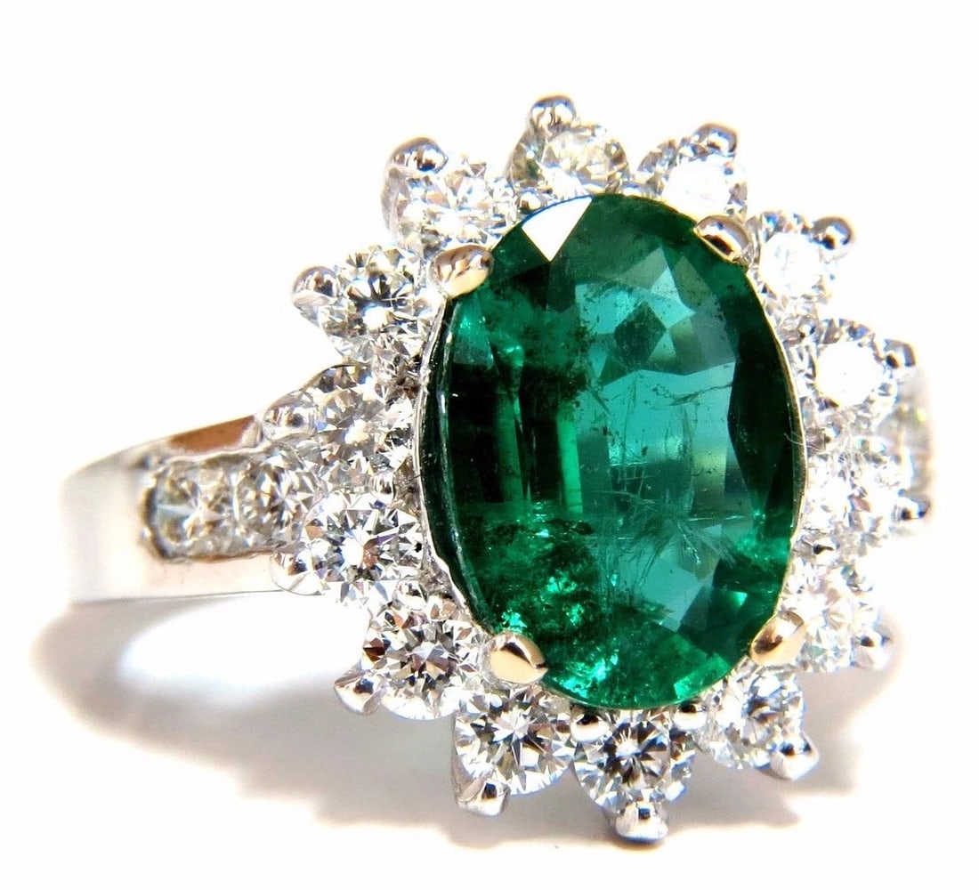 4.02ct Natural oval Emerald diamond cocktail halo ring 18kt *v: Title: 4.02ct Natural oval Emerald diamond cocktail halo ring 18kt *v Description: MAGNIFICENT JEWELS Halo Cocktail Greens 2.62ct. Natural Emerald Ring Transparent / clean clarity Vivid Green 11.3 X 7
