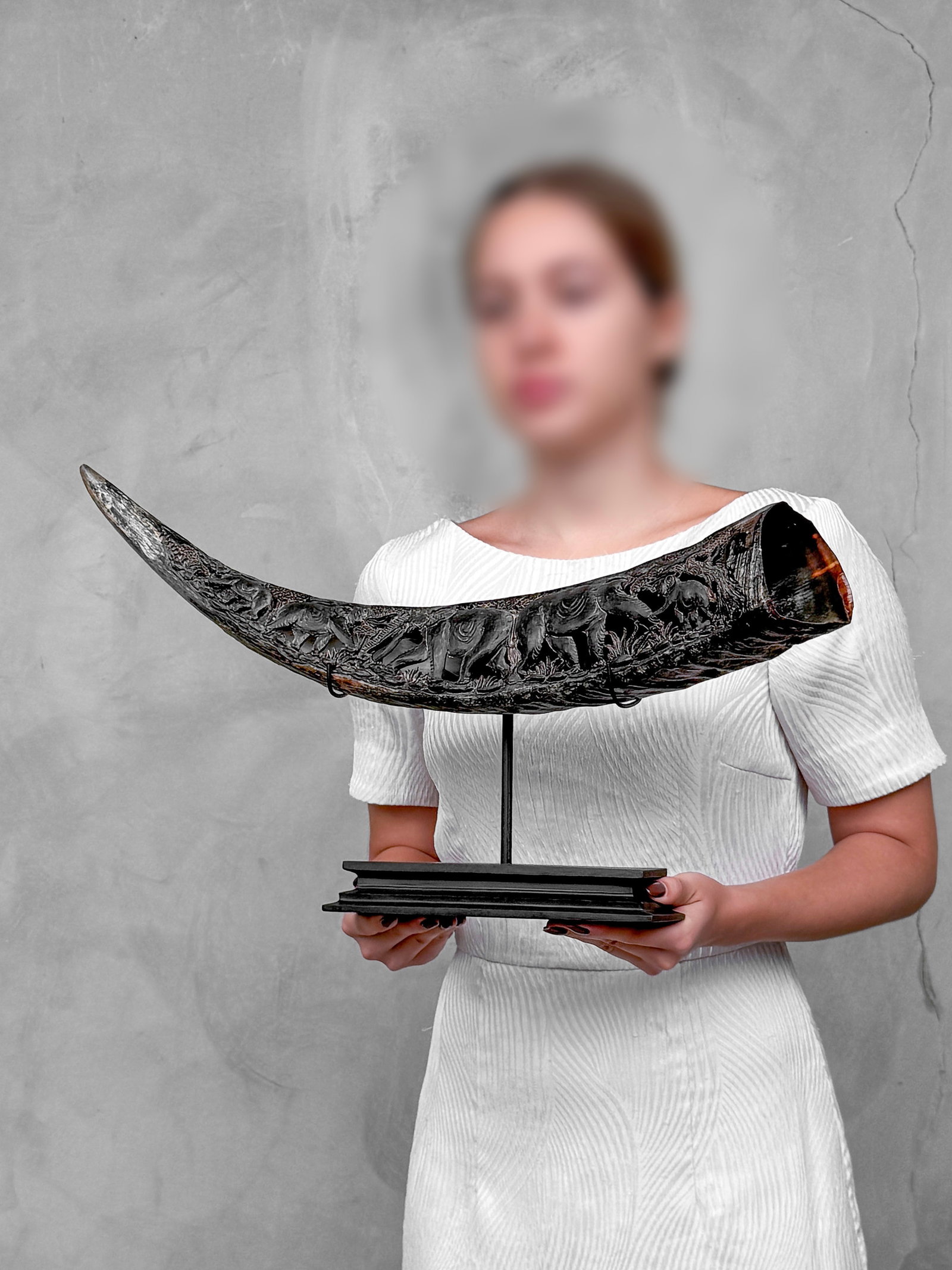 Finely engraved large waterbuffalo horn - Elephants motif: Title: Finely engraved large waterbuffalo horn - Elephants motif Maker:Unknown Origin: Indonesia Date/Period:2026 Materials:Bubalus bubalis horn, steel, wood Dimensions:Height including stand: 30 cm /