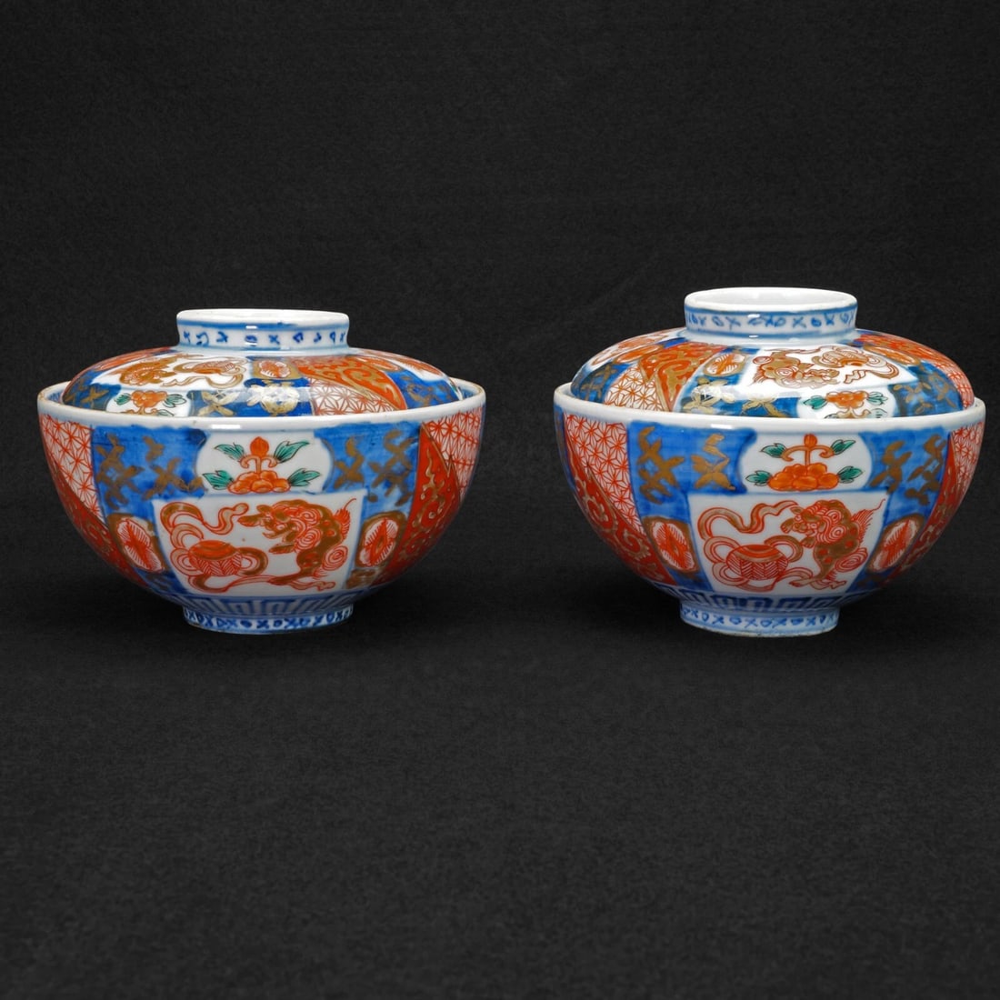 Pair 19th C Arita Imari Chawan Lidded Bowls: Title:Pair 19th C Arita Imari Chawan Lidded Bowls Size:4 ¾ in (12.1 cm) diameter x 3 ½ in (8.9 cm) tall. Description:A pair of colorful and finely-painted antique Japanese porcelain