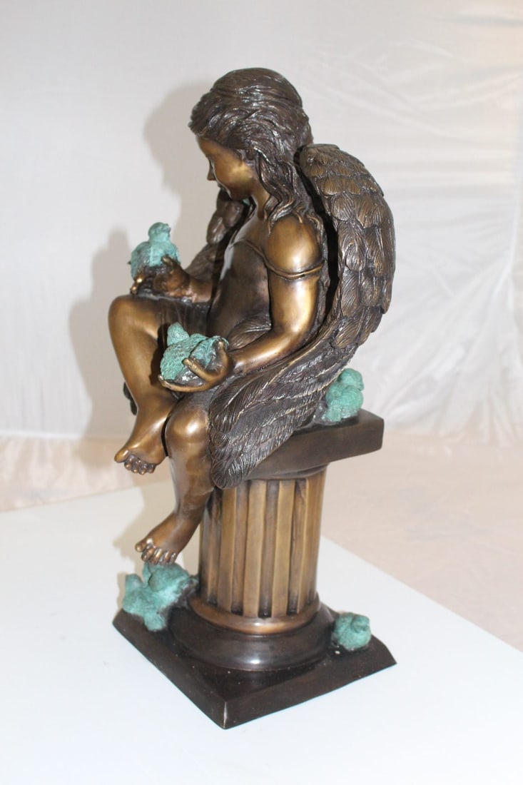 Angel sitting on Column Bronze Statue - Size: 10"L x 9"W x 22"H. - 12