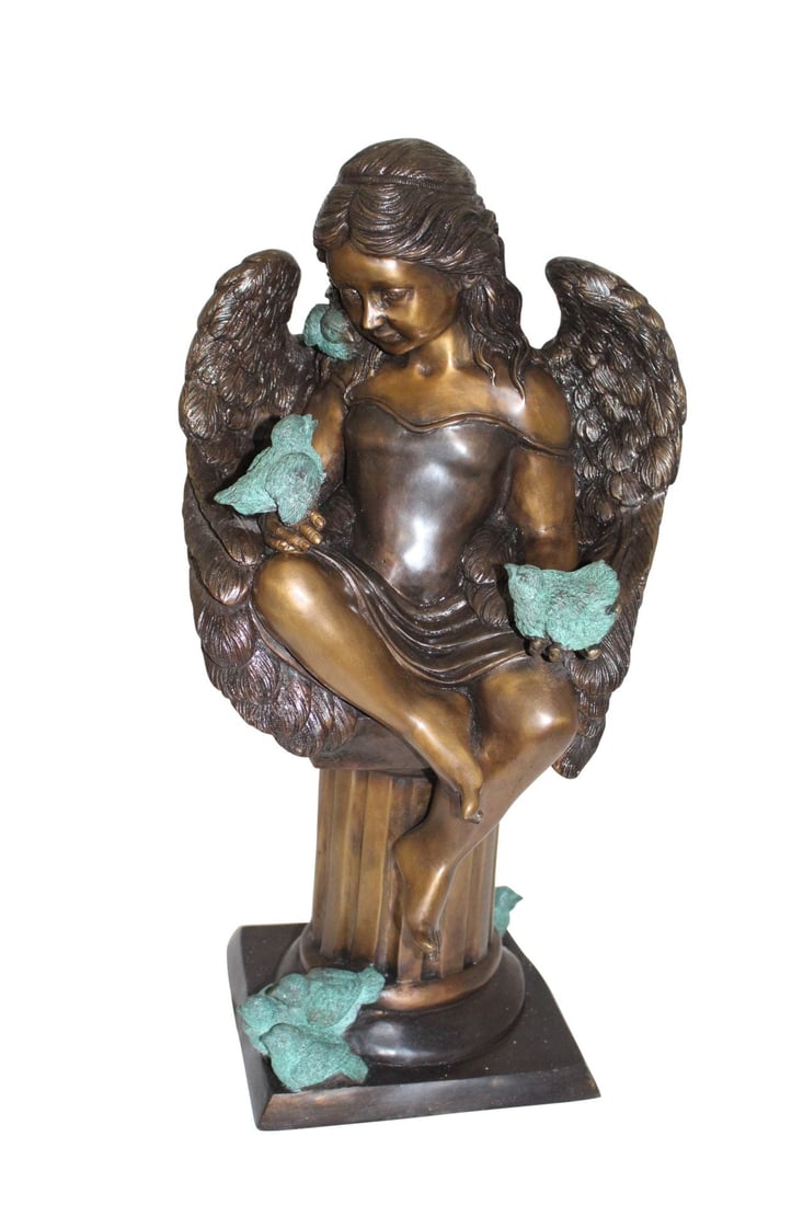 Angel sitting on Column Bronze Statue - Size: 10"L x 9"W x 22"H.: Title:Angel sitting on Column Bronze Statue - Size: 10"L x 9"W x 22"H. Description:This is a gorgeous statue of an angel sitting on a column. The angel has doves in her hands, all of them which