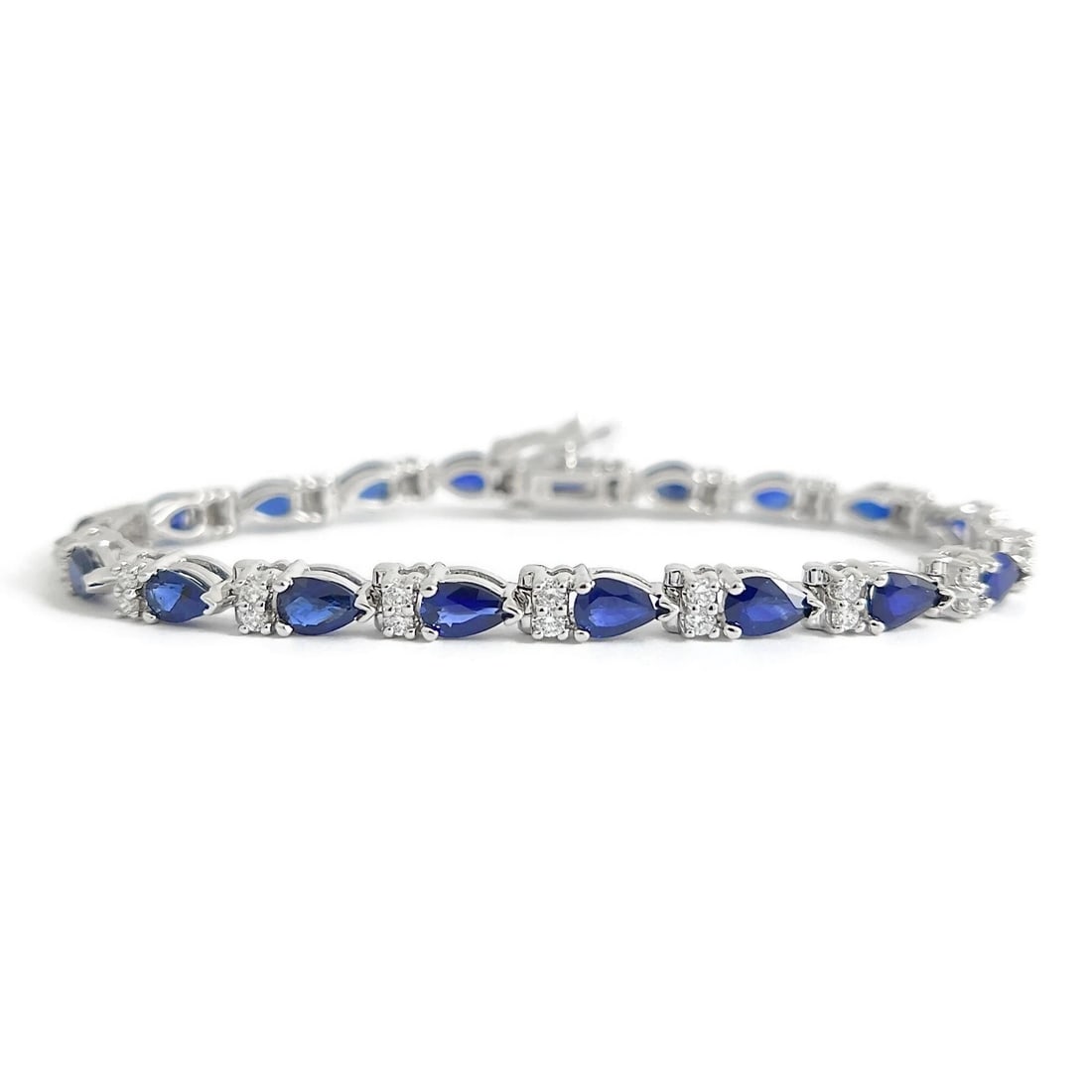 Pear Blue Sapphire Diamond Gemstone Tennis Bracelet 14K White Gold, 9.39 CTW: Pear Blue Sapphire Diamond Gemstone Tennis Bracelet 14K White Gold, 9.39 CTW This is a gorgeous bracelet! Please let us know if you have any questions :) Gemstones: 19 pear blue sapphires 8.35 ctw, AA