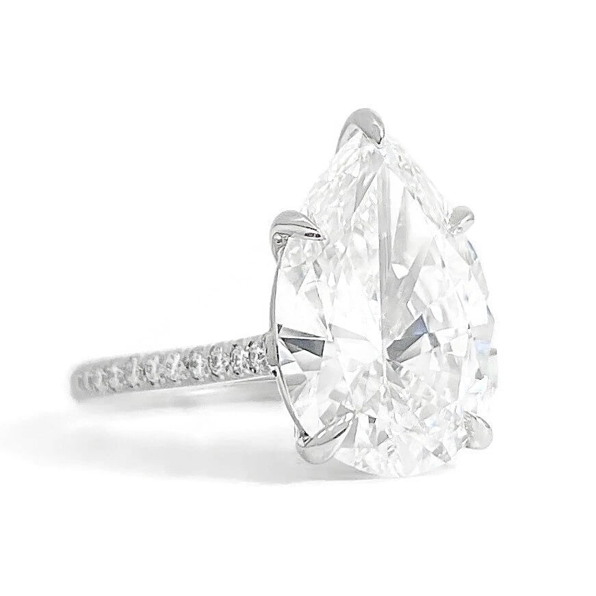 GIA Pear Diamond Solitaire Engagement Ring Platinum, 5.20 CTW: GIA Pear Diamond Solitaire Engagement Ring Platinum, 5.20 CTW This is a gorgeous diamond engagement ring! Please let us know if you have any questions! Diamonds: 5.20 ctw; 1 pear 5.02 ct, G, VVS1 and 