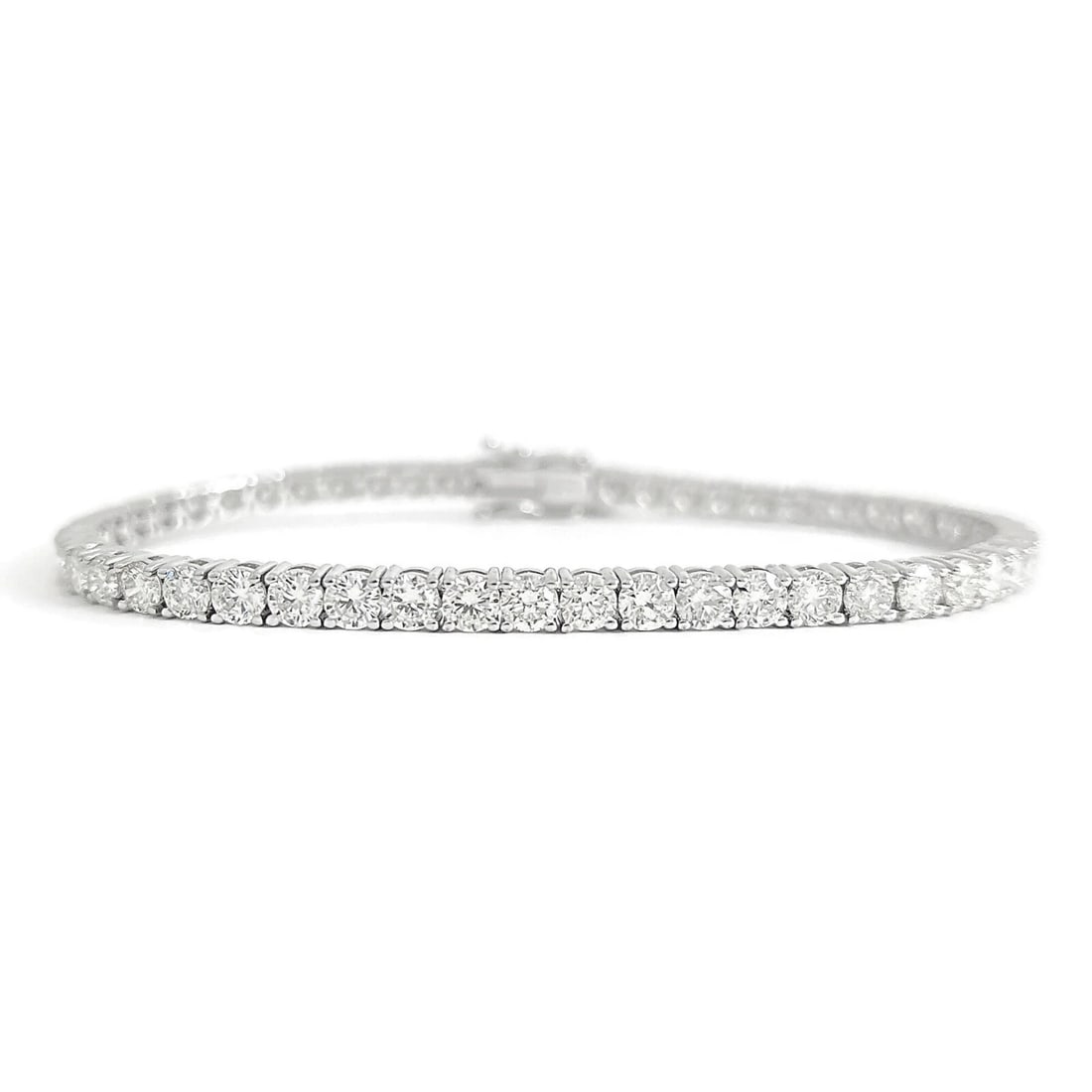 Round Diamond Tennis Bracelet 14K White Gold, 7 Inches, 8.03 CTW: Round Diamond Tennis Bracelet 14K White Gold, 7 Inches, 8.03 CTW This is a lovely bracelet! Please let us know if you have any questions :) Diamonds: 52 round brilliant cuts, 8.03 ctw, H-I-J, VS2 Meta