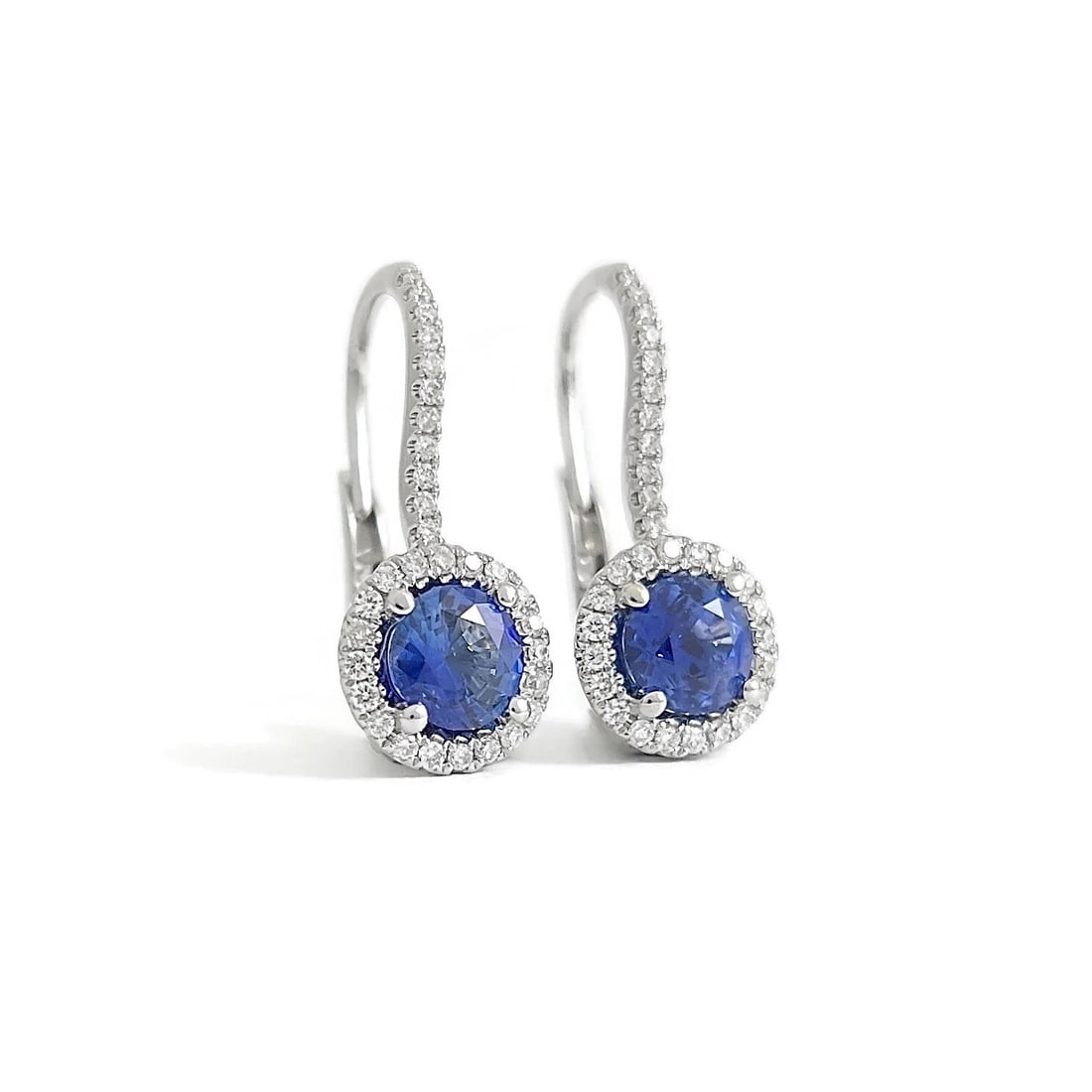 Round Blue Sapphire Diamond Halo Drop Earrings 18K White Gold, 2.05 CTW: Round Blue Sapphire Diamond Halo Drop Earrings 18K White Gold, 2.05 CTW These are beautiful earrings! Please let us know if you have any questions. Gemstones: 2 round blue Ceylon sapphires 1.55 ctw