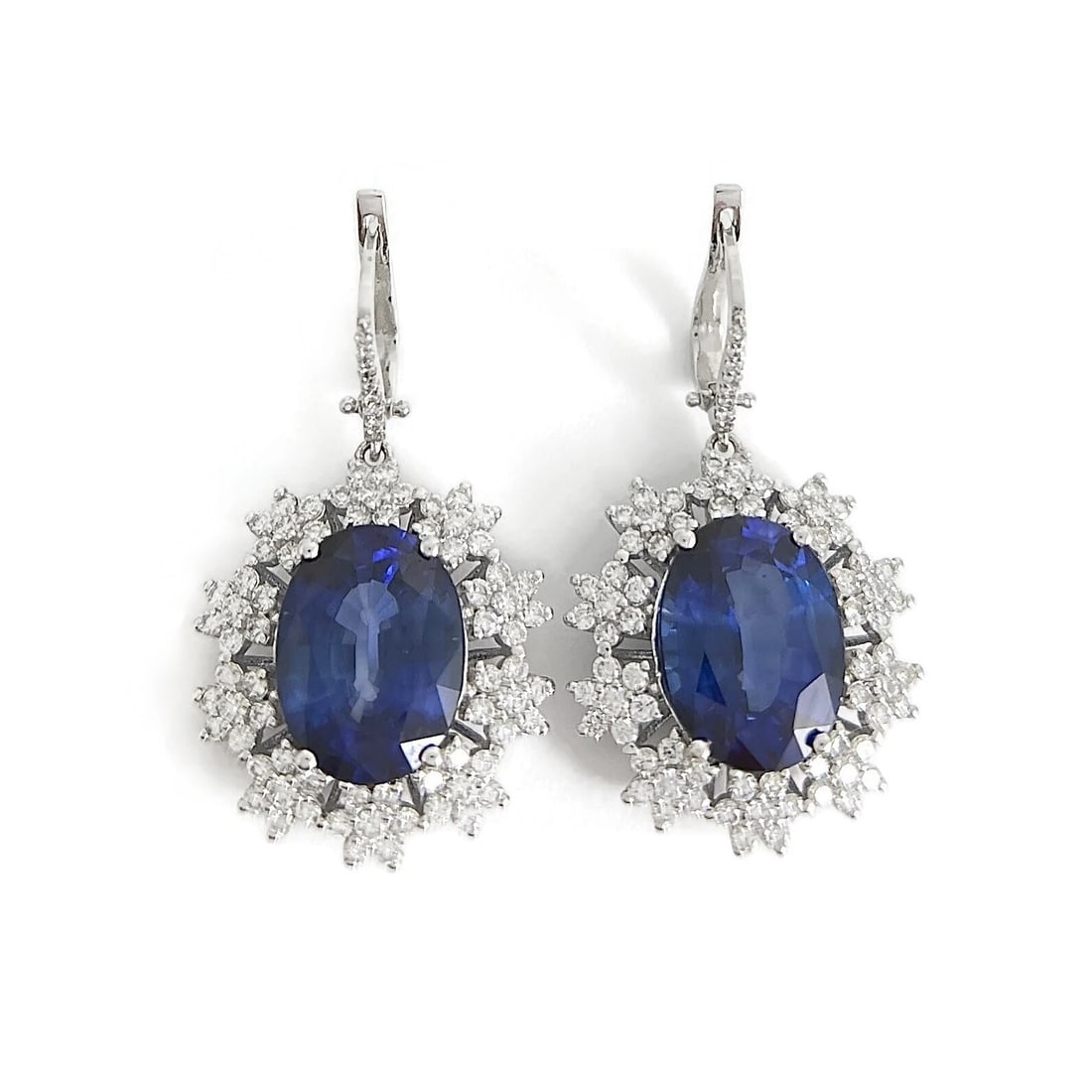 Oval Blue Sapphire Diamond Halo Dangle Drop Earrings 18K White Gold, 21.57 CTW: Oval Blue Sapphire Diamond Halo Dangle Drop Earrings 18K White Gold, 21.57 CTW These are beautiful earrings! Please let us know if you have any questions. Gemstones: 2 oval blue simulated sapphires 18
