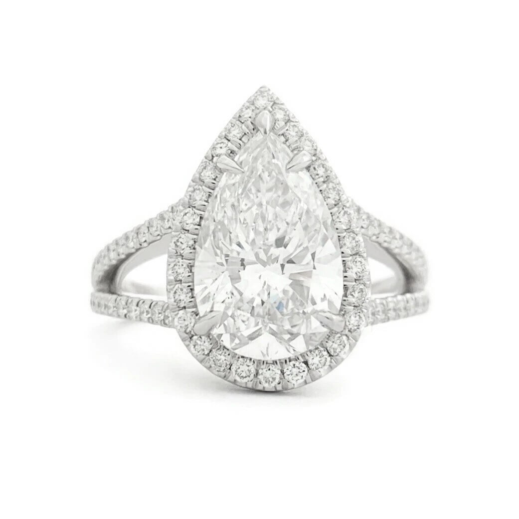 GIA Pear Diamond Halo Split Shank Engagement Ring Platinum, 3.39 CTW: GIA Pear Diamond Halo Split Shank Engagement Ring Platinum, 3.39 CTW This is a gorgeous diamond engagement ring! Please let us know if you have any questions! Diamonds: 3.39 ctw; 1 pear shape, 2.57 ct