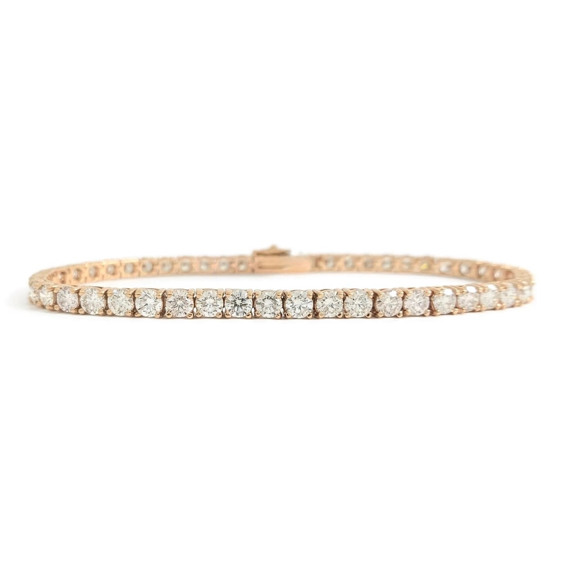 Round Diamond Tennis Bracelet 14K Pink Rose Gold, 7 Inches, 7.05 CTW: Round Diamond Tennis Bracelet 14K Pink Rose Gold, 7 Inches, 7.05 CTW This is a gorgeous bracelet! Please let us know if you have any questions :) Diamonds: 51 round brilliant cuts, 7.05 ctw, I-J, VS2-