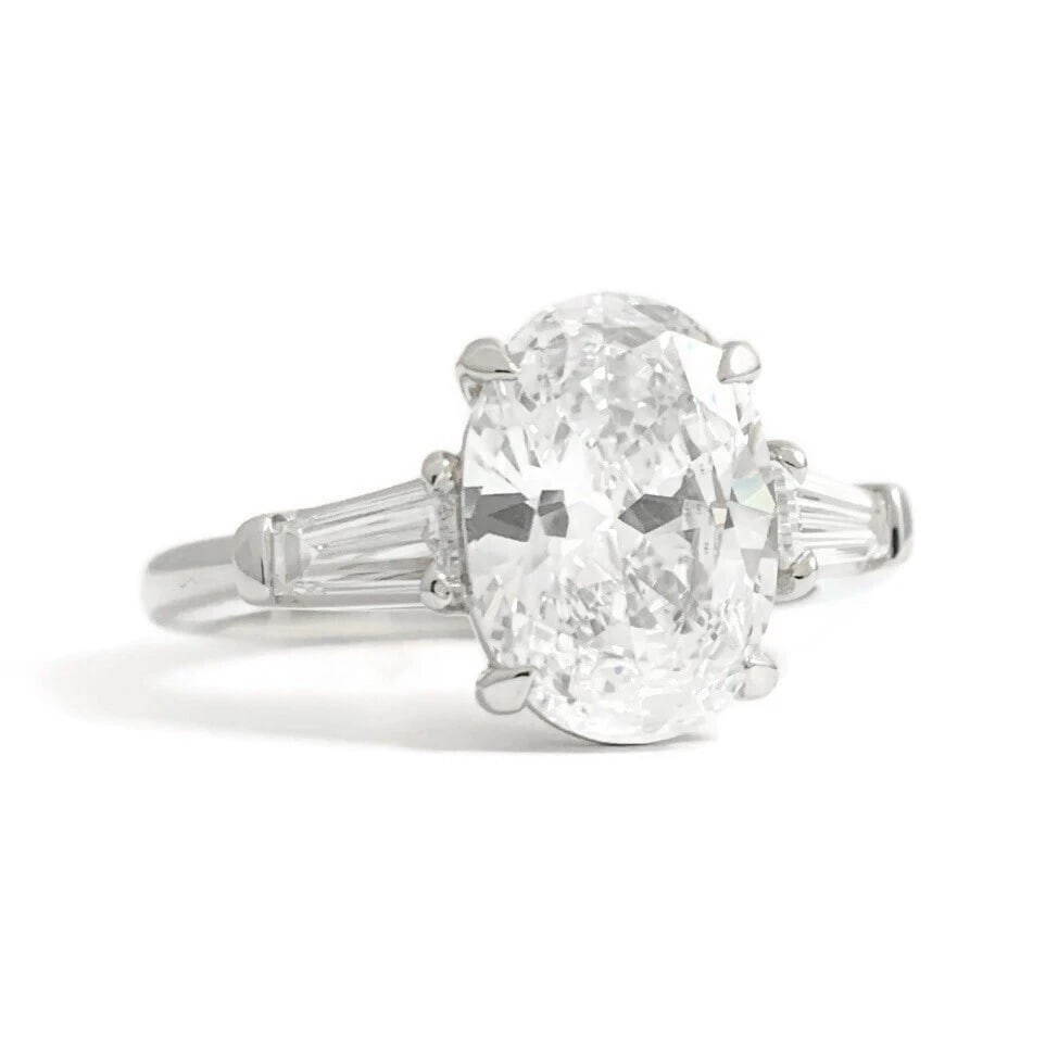 GIA Oval Tapered Baguette Diamond Engagement Ring Platinum, 2.35 CTW: GIA Oval Tapered Baguette Diamond Engagement Ring Platinum, 2.35 CTW This is a gorgeous diamond engagement ring! Please let us know if you have any questions! Diamonds: 2.35 ctw; 1 oval cut, 2.00 ct, 