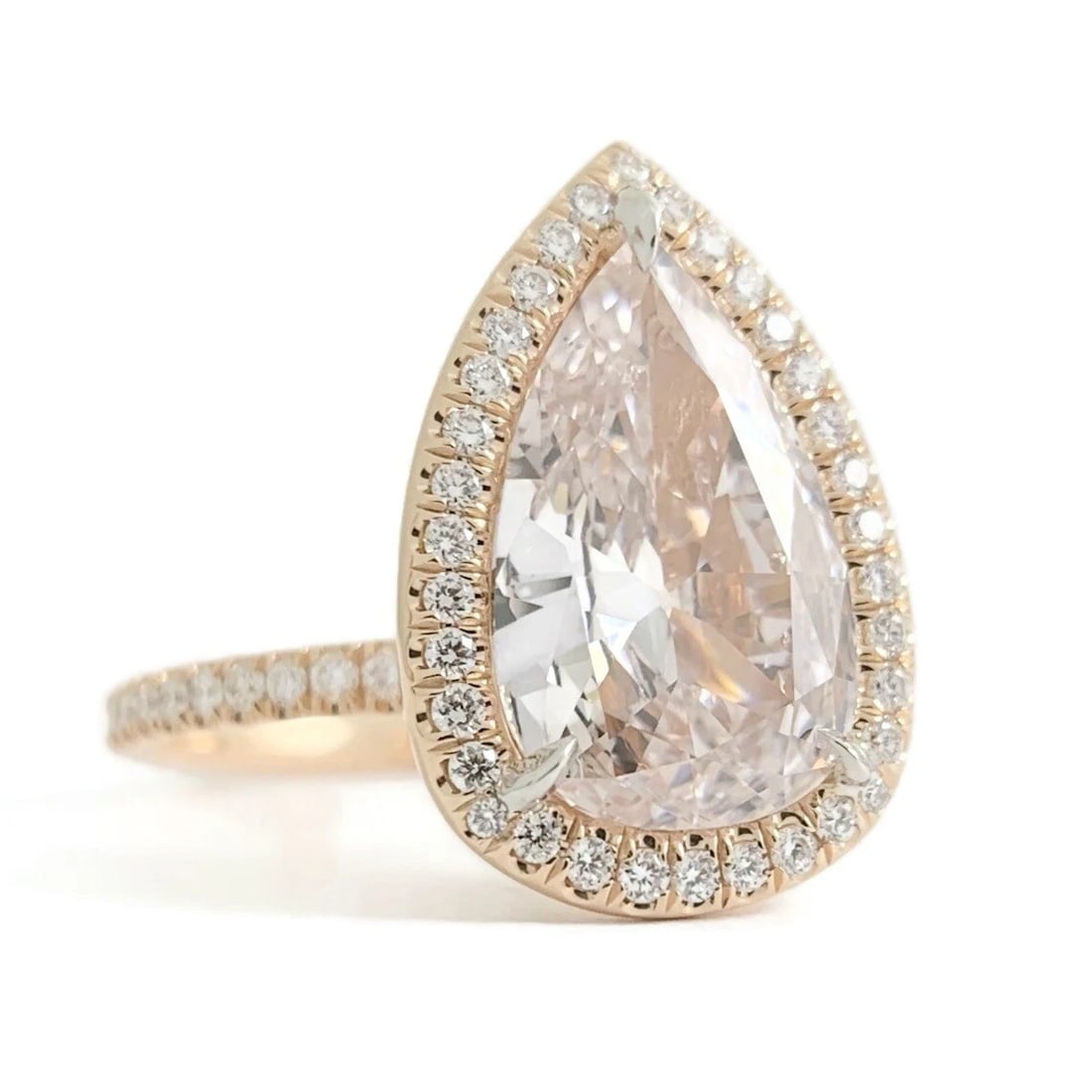 GIA Pear Fancy Light Pink Diamond Halo Engagement Ring 18K Rose Gold 2.77 CTW: GIA Pear Fancy Light Pink Diamond Halo Engagement Ring 18K Rose Gold 2.77 CTW This is a gorgeous diamond engagement ring! Please let us know if you have any questions! Diamonds: 2.77 ctw; 1 pear cut