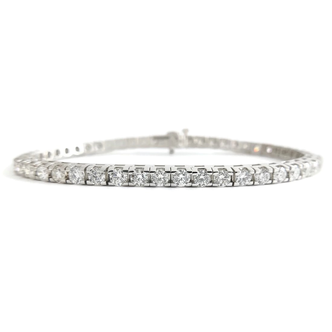 Round Diamond Tennis Bracelet 14K White Gold, 5.01 CTW, 7 Inches, 14.56 Grams: Round Diamond Tennis Bracelet 14K White Gold, 5.01 CTW, 7 Inches, 14.56 Grams This is such a gorgeous tennis bracelet! Please let us know if you have any questions. Diamonds: 50 round brilliant cuts,